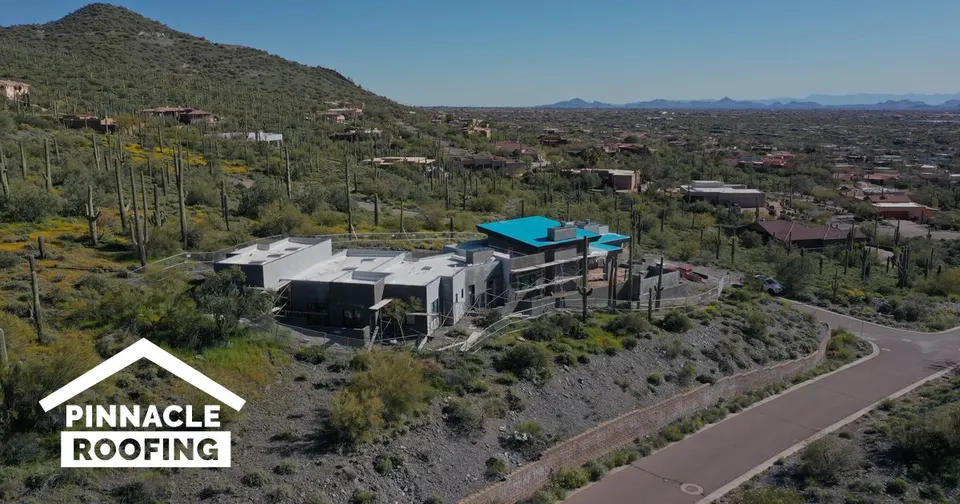 Pinnacle Roofing website hero showing a desert hillside home