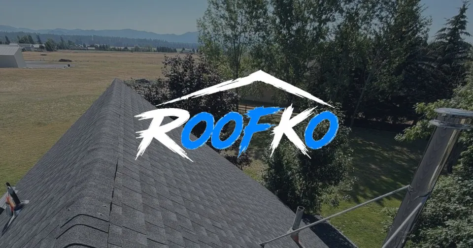 RoofKo website hero with drone shot of a completed asphalt shingle roof